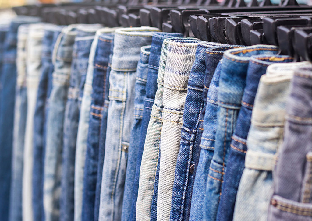 Jeans hung up in a row
