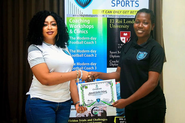 Ajewole Esther receives her certifcate after completing the Modern Day Coaching Workshop