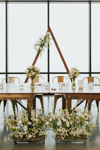 Bridal head table with flowers