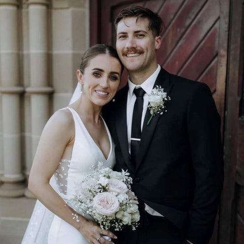 Smiling bride and groom