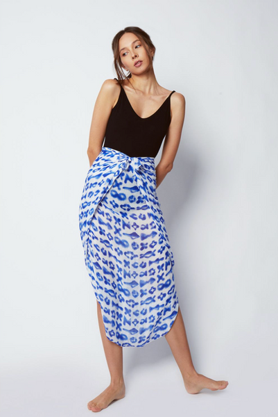 The Santorini Sarong by Shinjuku Lanes is a beautiful swimsuit cover-up that doubles as a scarf