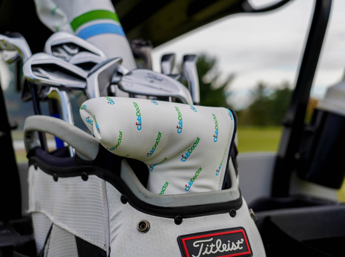 An elegant golf putter cover adorned with multiple Club Doctor logos, providing a visual representation of premium quality and dedicated club protection, ensuring your golf putter is shielded from wear and tear while showcasing your allegiance to a brand committed to superior golf club maintenance and performance.