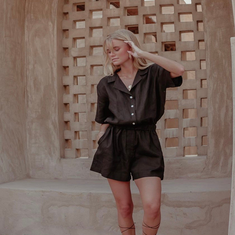 Sustainable black playsuit from Palm Collective