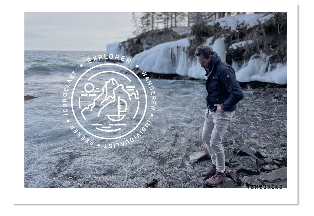 Venturian WatchWorks founder Jason Strong on the shore of Lake Superior wearing a Wildsider solar titanium compass watch #menswatch