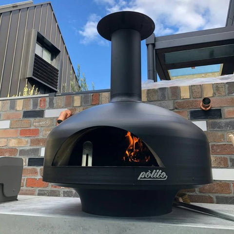 black polito oven with creasote inside