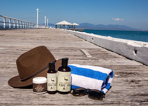 Emu oil and hat on jetty