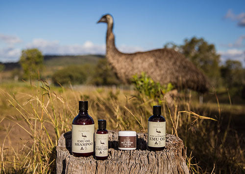 OzWellness products on farm with emu in background