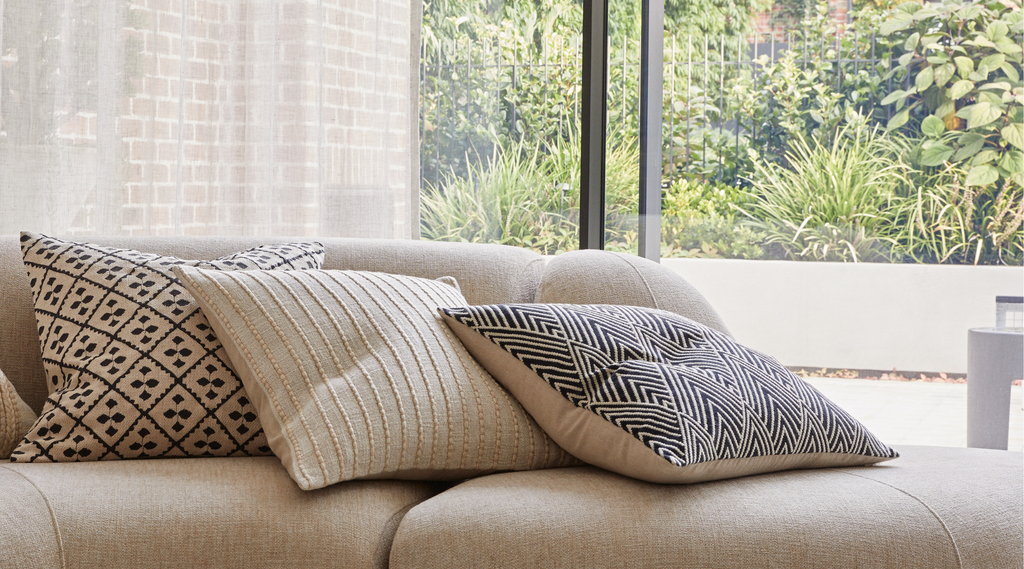 Weave cushions rule of threes. Luxe cushions on couch