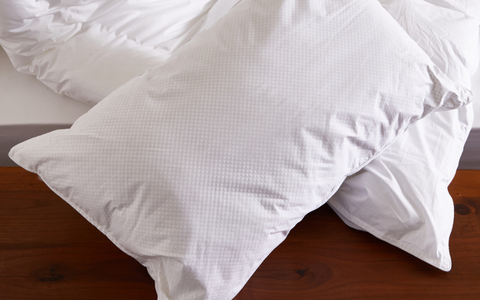 WHITE FILLED PILLOWCASE ON A BED
