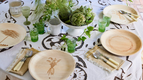 maaterra compostable palm leaf plates set on a table for a garden party.