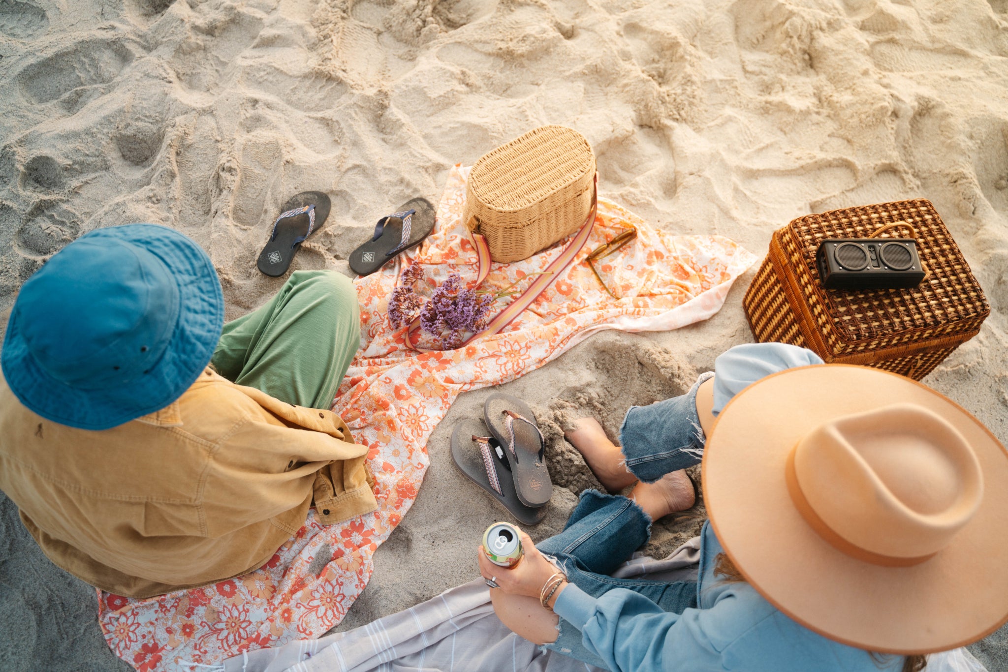 People on beach drinking soda with sandals