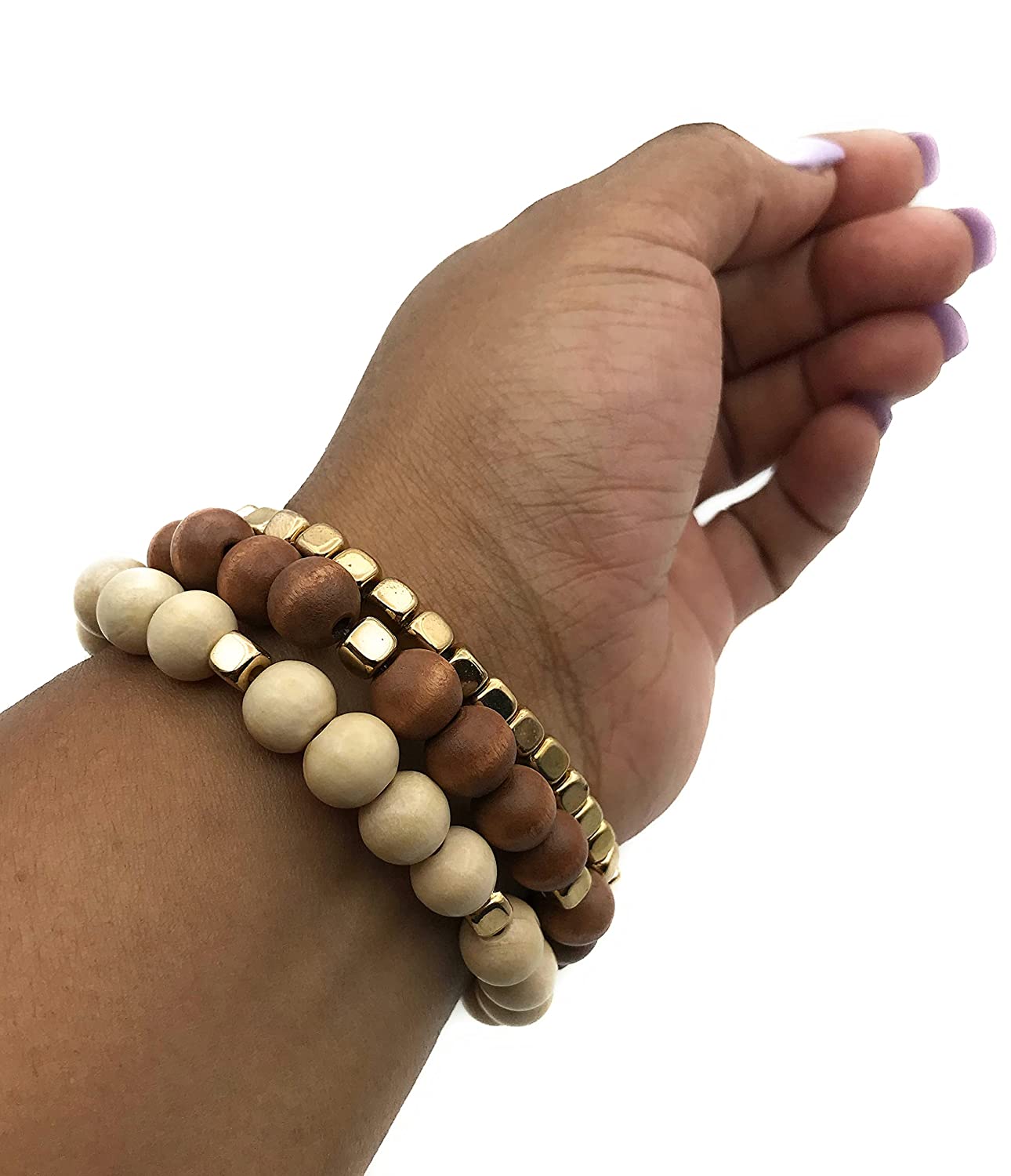 Set of Gold and Wooden Bead Bracelets Displayed on the Wrist by Scott D Jewelry Designs