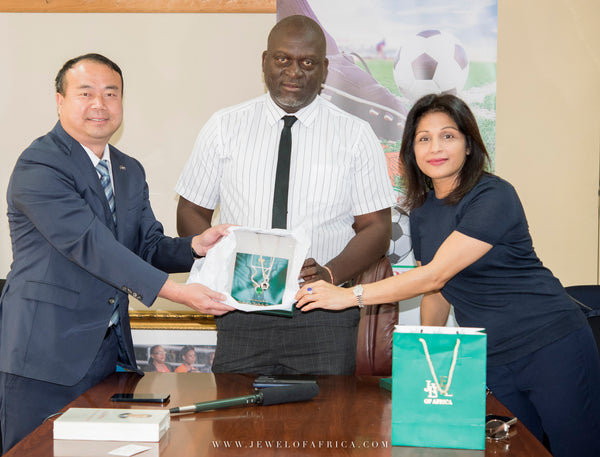 Jewel of Africa's CEO, Ms. Rashmi Sharma handing over the auctioned Black Tourmaline piece to Mr. Ming of Higer Buses Zambia Limited.