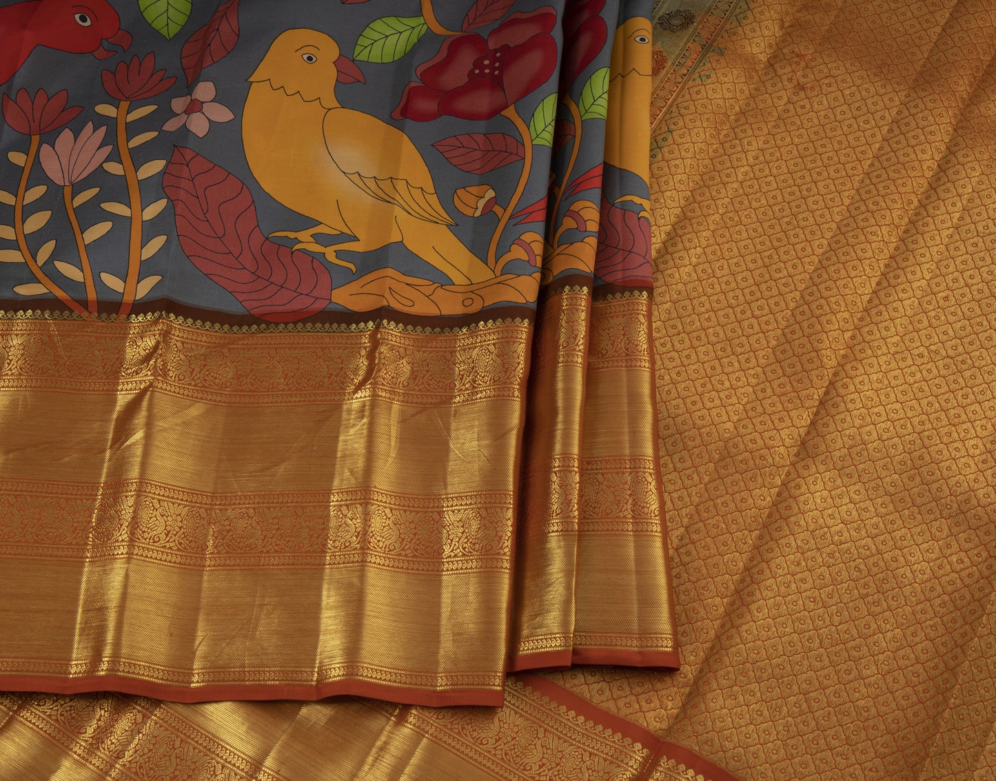 Grey printed kalamkari worked silk saree with goden zari worked orange border