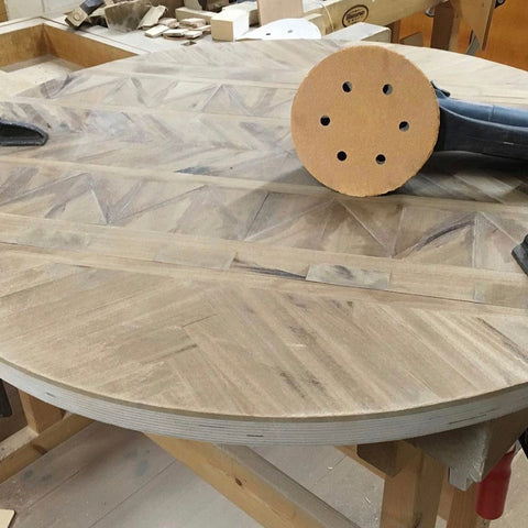 tabletop being sanded