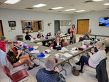 Class of knitters making cat blankets