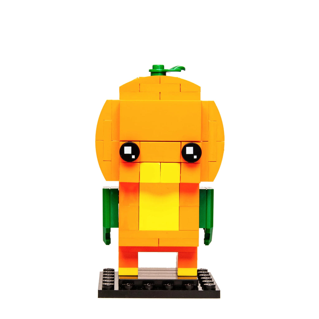 Custom Lego BrickHeadz model of a cheerful orange bird with green wings, standing against a white background.