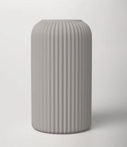 A cylindrical vase with ribbed texture.