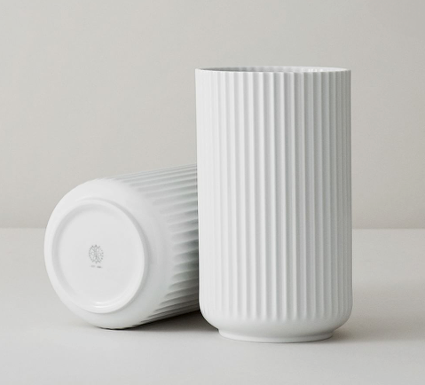 Sleek, tall white porcelain vases.