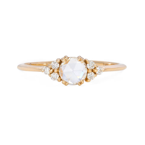 sparkling rose-cut diamond ring, center round diamond surrounded by clusters on either side on a yellow gold band