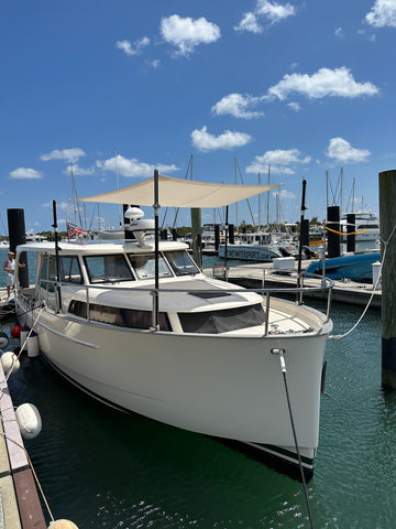 sunfly shade on bow of boat with anodized carbon fiber poles