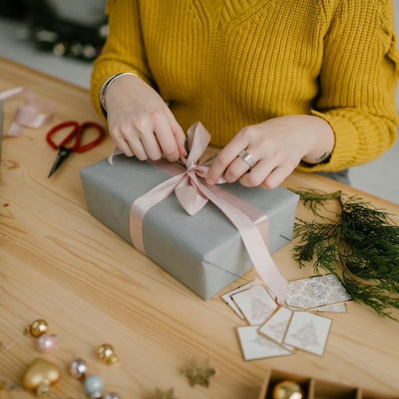 a person wrapping a present