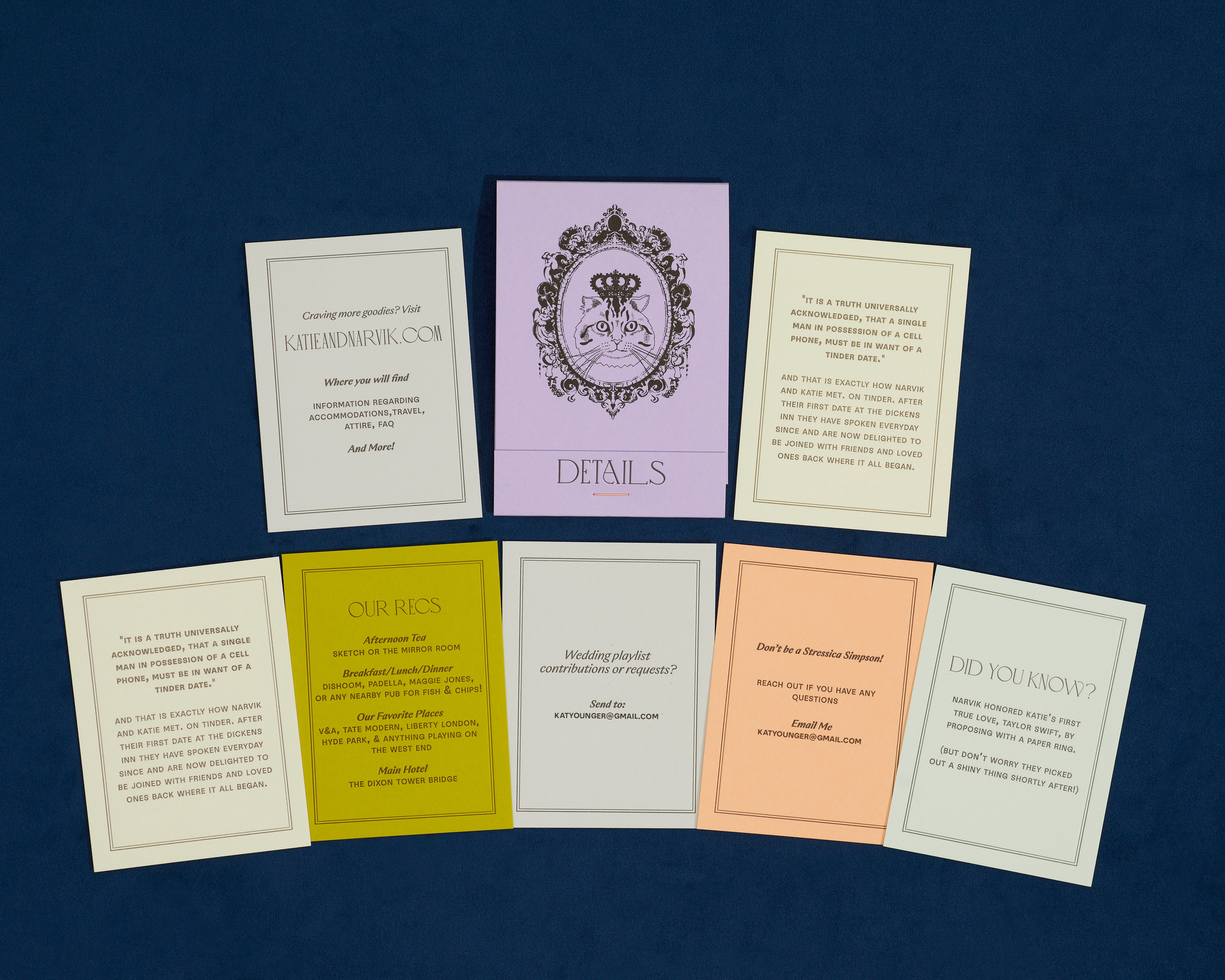 Letterpress details cards of various colors in a lavender paper matchbook with cat illustration