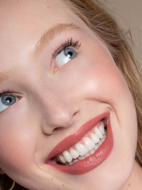 Woman Smiling Wearing ILIA Mascara