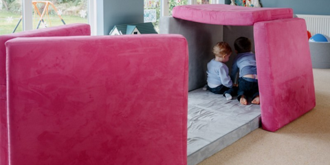 Nugget Play Couch being played on by children with Sofee Play Sofa. 