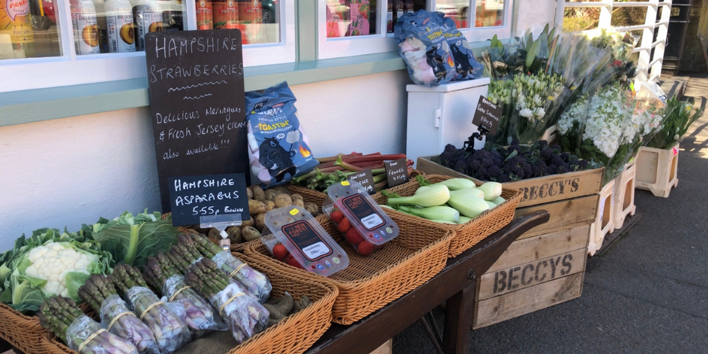 Local fruit and vegetables displayed outside Beccys Greengrocers in Stockbridge, Hampshire