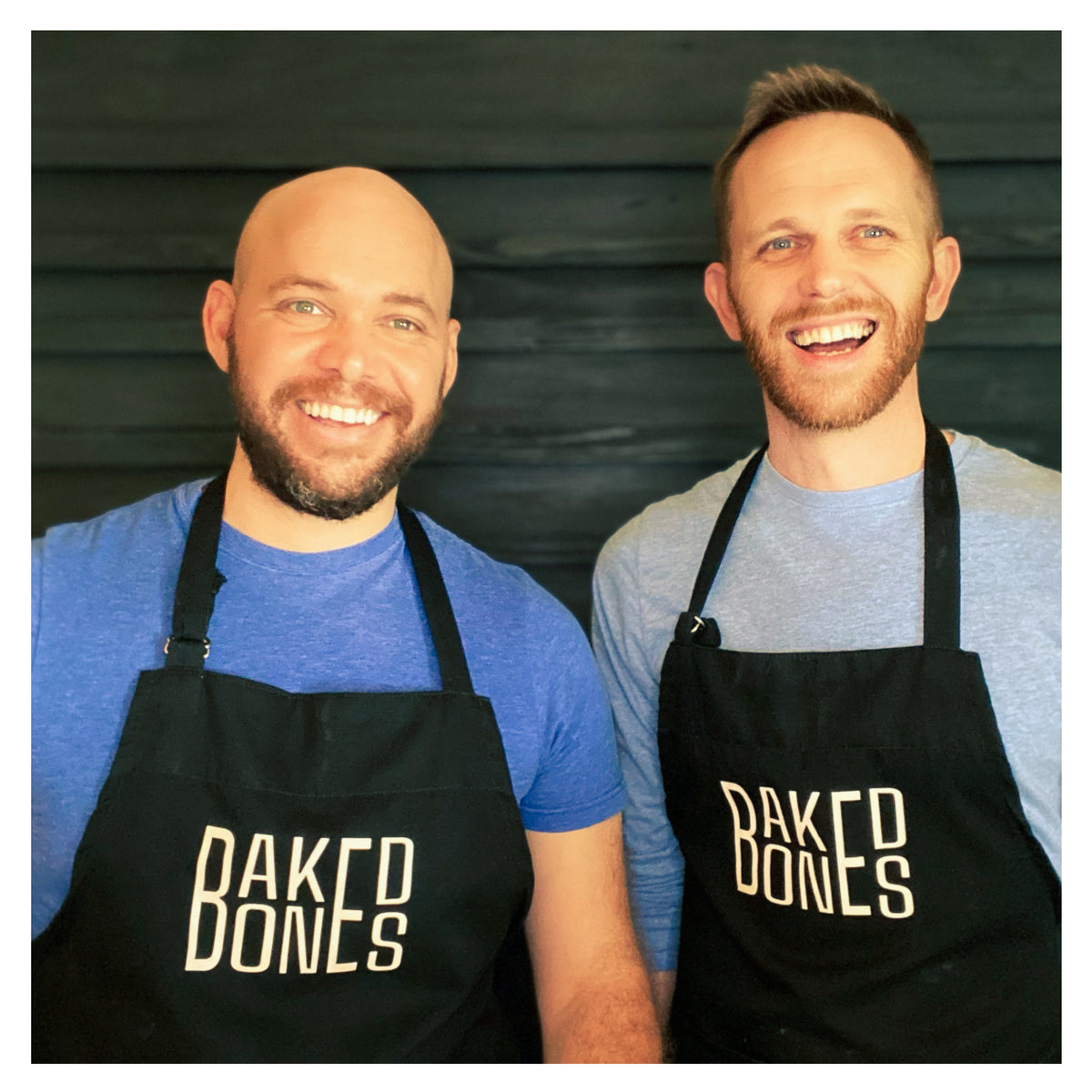 Photo of the founders of BakedBones CBD for dogs wearing blue shirts and black aprons labeled with 