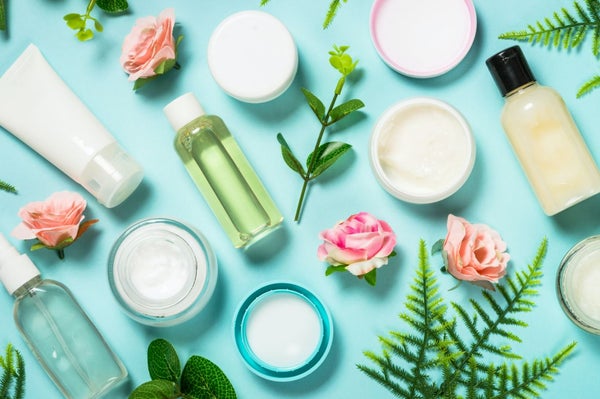 Various beauty products and flowers