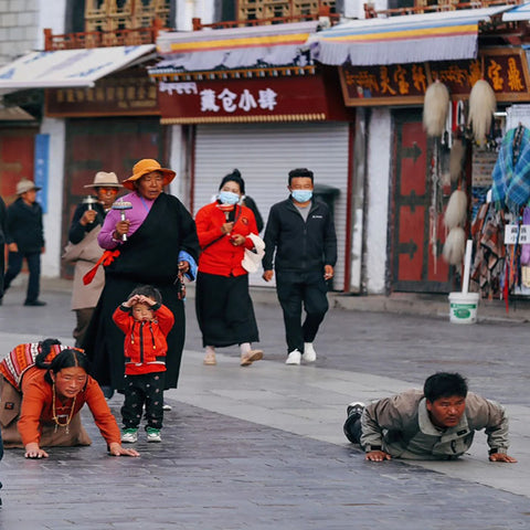 People Bowing in Devotion in Tibet