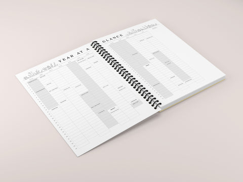 a planner laid open on a pink background