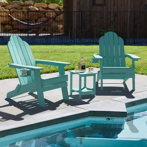 2 Blue Foldable Adirondack Chairs with Cup Holder With Side Table at Poolside