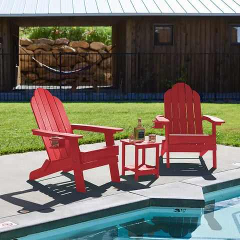 2 Red Foldable Adirondack Chairs with Cup Holder With Side Table at Poolside