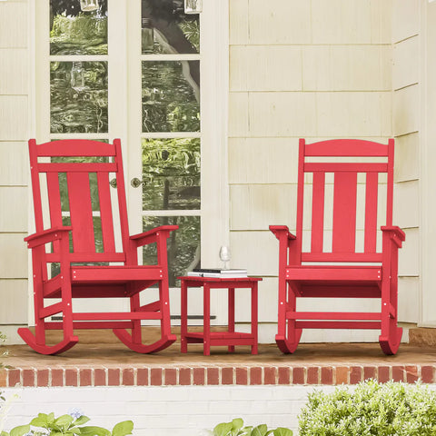 2 red Outdoor Adirondack Rocking Chairs with a side Table on the porch