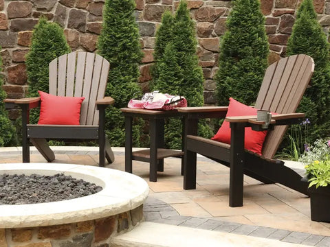 two Adirondack Chairs with red cushions and side table
