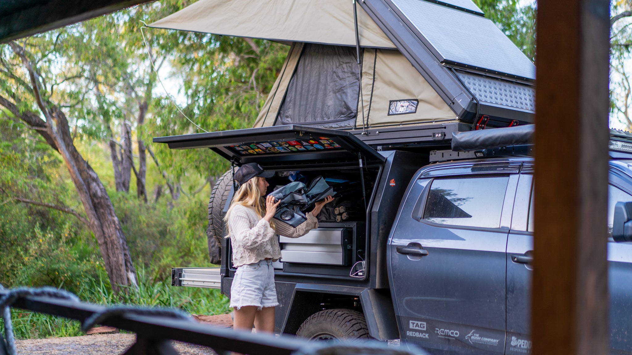 Em packs camp chair into 4x4 canopy