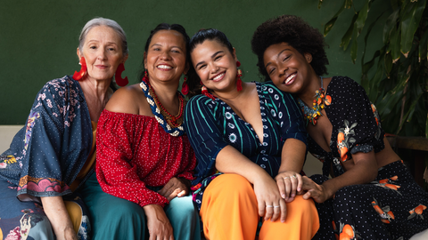 group of ethnically diverse women middle aged, happy, sitting 