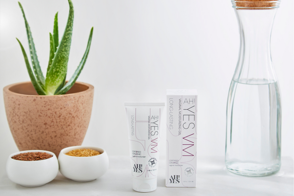 AH! YES vaginal moisturiser product next to plant set up