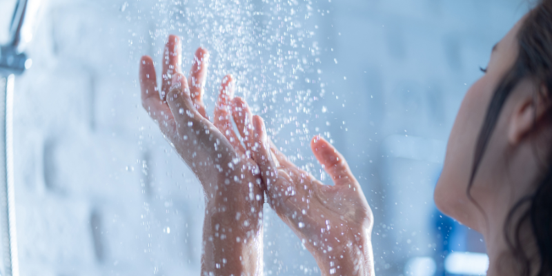 Close up of women's hands washing in shower