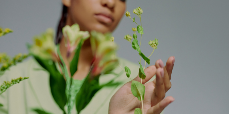 women touching natural plant