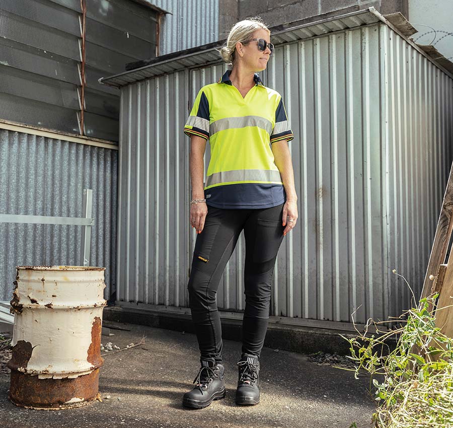Woman in she wear she does black safety boots, hi vis