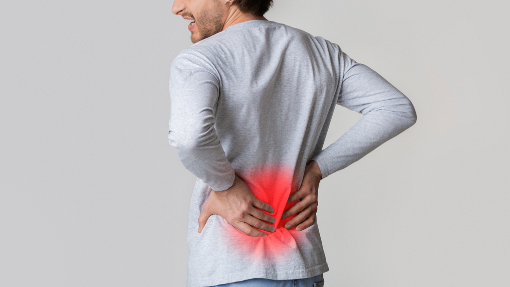 Pain in back and kidneys of man