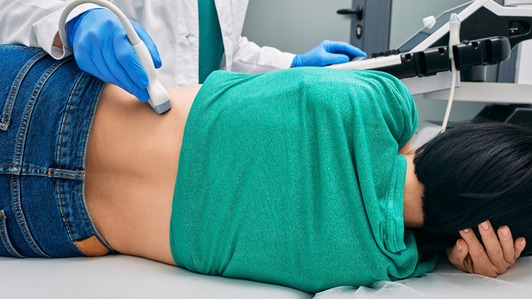 Doctor checking for kidney stones in the emergency room