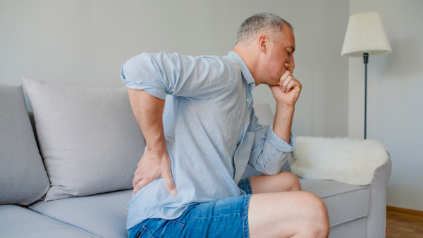 man suffering from kidney stone pain