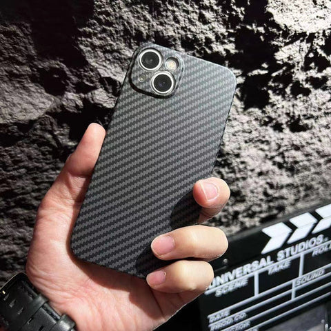 a man's hand wears cool watch and holds a carbon fiber iPhone case