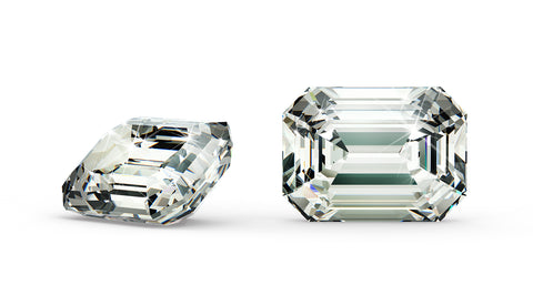 Close up of two emerald cut diamonds