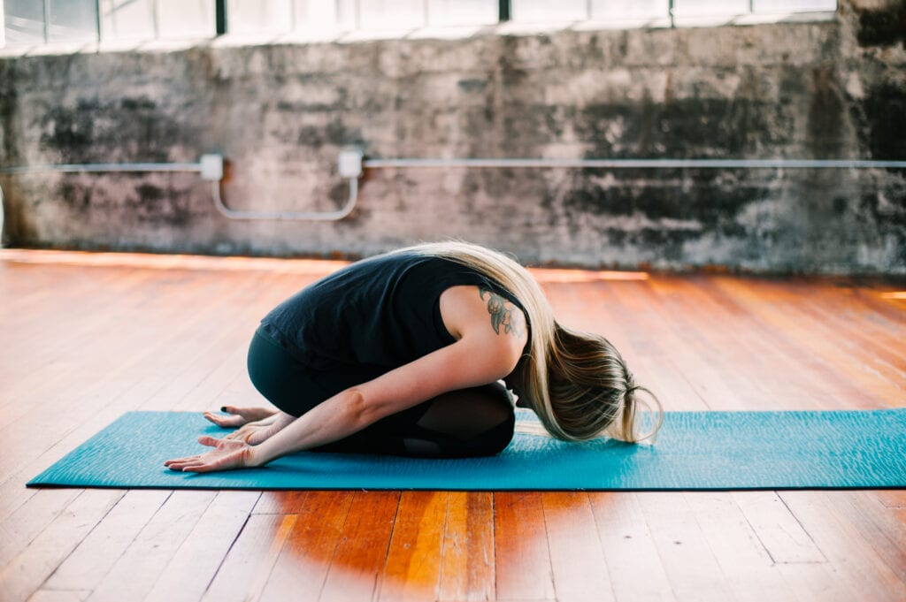 embryo child's pose variation yoga resting yoga pose restorative yoga pose